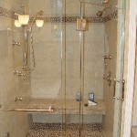 custom-shower-with-steam-body-sprays-stone-tile-floor-matching-border-shivikashi-granite-seat